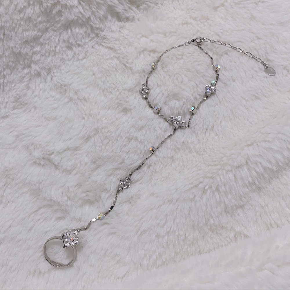 Hand jewelry piece (ring with attached bracelet) + extra ring